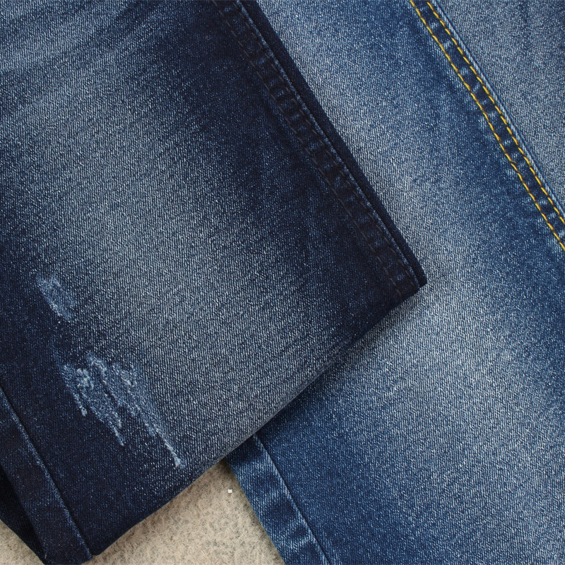 denim fabric  with stretch suitable for women jeans making at 9.9 OZ in dark  blue color